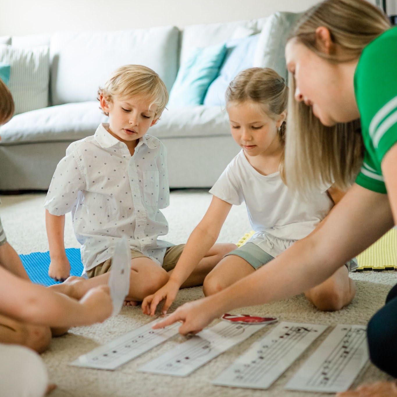 Ms. Rachel working with children on music flashcards